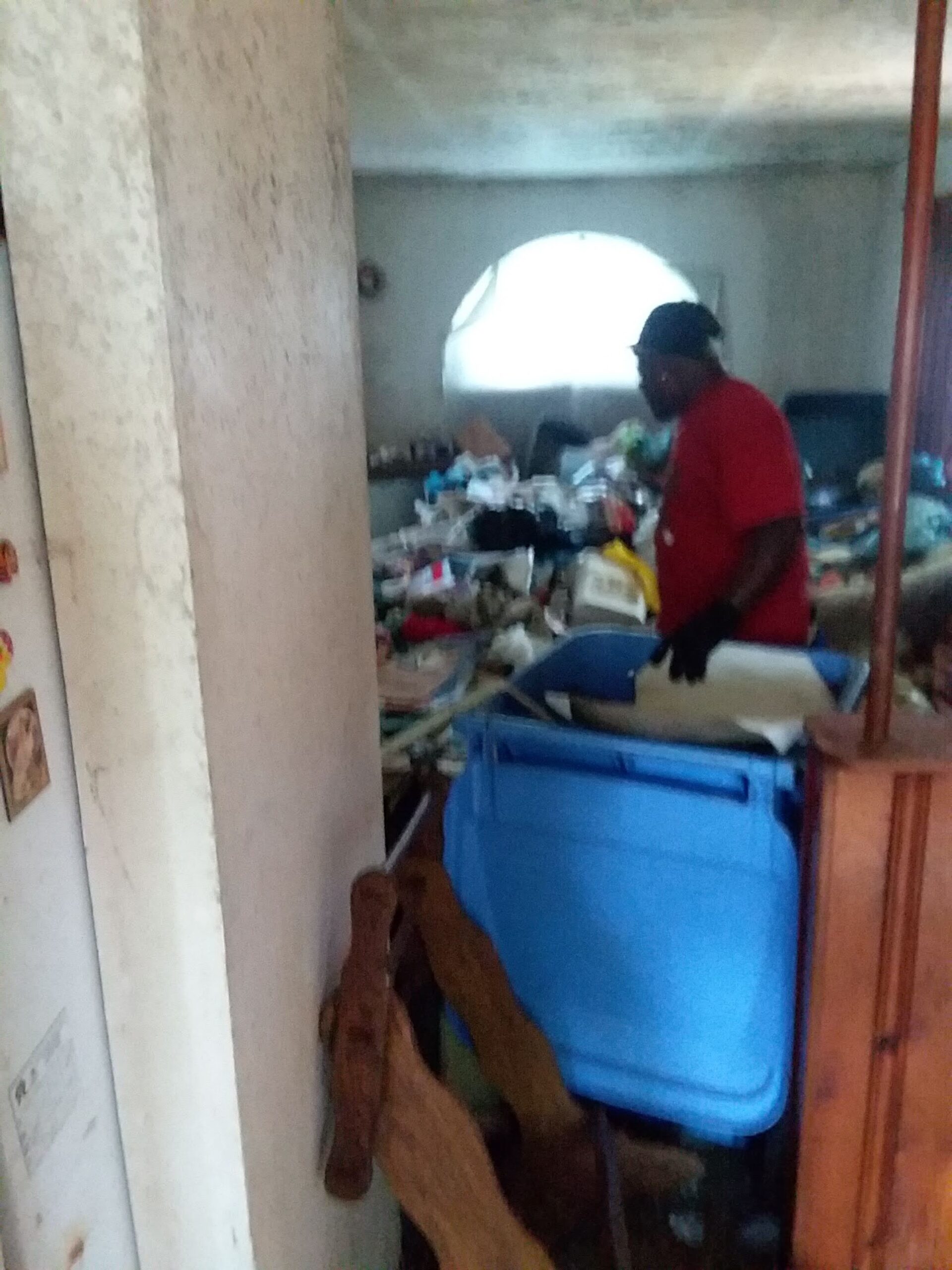 Man Removing Trash Inside the House